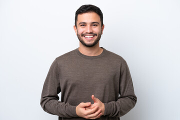 young brazilian man isolated on white background laughing