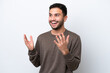 © luismolinero - Young Brazilian man isolated on white background with surprise facial expression