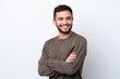 © luismolinero - Young Brazilian man isolated on white background with arms crossed and happy