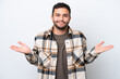 © luismolinero - Young Brazilian man isolated on white background having doubts while raising hands