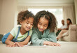 © Siphosethu F/peopleimages.com - Nothing compares to a sisters love. Shot of two sisters using a digital tablet at home.