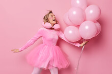 Glad Positive Woman Has Festive Mood Wears Dress Poses With Balloons Enjoys Special Occasion Celebrates Anniversary Applies Beauty Patches To Look Young Gets Ready For Party Isolated On Pink Backgroud