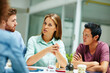 © Daniel L/peopleimages.com - Talking the team through her ideas. Shot of a group of businesspeople talking together around a table in an office.