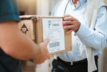 Another Successful Delivery Made. Closeup Shot Of An Unrecognisable Man Making A Delivery To A Customer At Their Home.