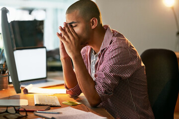 Aufkleber - I wish all these deadlines would just disappear. Cropped shot of a young designer looking stressed out while working late in an office.