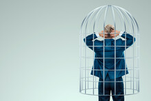 Businessman In A Suit In A Metal Cage. Possibilities Are Limited, Business Metaphor, Mind Prison, Problems, Difficulties.