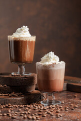 Coffee and chocolate drinks with whipped cream.