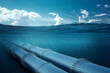© Aliaksandr Marko - Gas pipeline under water, metal pipes at the bottom of the sea. The concept of oil pipeline, gas pipeline, gas transportation. copy space.