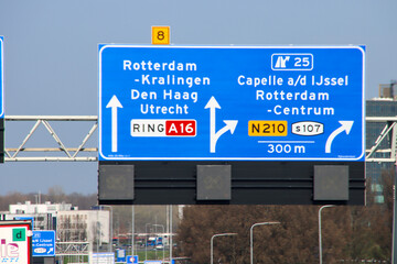 Wall Mural - Blue direction and information sign for the directions on Motorway A16 to Capelle on N210