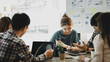 © kamiphotos - Groups of people gathered in the conference room, they were having a brainstorming meeting and planning meetings to manage the company's growth and profit. Management concept from the new generation.
