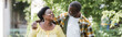 © LIGHTFIELD STUDIOS - happy senior african american couple walking in park, banner.