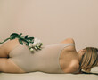 © Cavan Images - Woman Body Care. Woman couch for epilation and massage