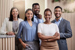© Nicholas Felix/peopleimages.com - Looking to the future. Shot of a team of businesspeople together in their office with their arms crossed.