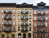 Fototapeta Miasto - Exterior view of old brick apartment buildings in the East Village neighborhood of New York City