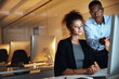 © Jadon Bester/peopleimages.com - Let no minute go to waste. Shot of two businesspeople working together on a computer in an office at night.