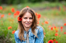 Beautiful Woman In Red Poppies