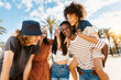 © Xavier Lorenzo - Group of multiracial happy young friends having fun together enjoying summer vacation on the beach - Focus on african couple