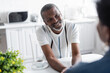 © LIGHTFIELD STUDIOS - happy senior african american man looking at wife.
