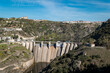 Entre montes e montanhas a barragem hidroelétrica de Miranda do Douro com a vila de Miranda ao fundo em Trás os Montes