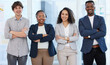 © Jade M/peopleimages.com - Confidence leads us through the day. Portrait of a group of confident businesspeople standing with their arms crossed in an office.