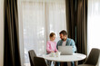 © BGStock72 - Father and daughter using laptop computer together