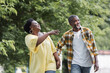 © LIGHTFIELD STUDIOS - happy senior african american couple holding hands and walking in park.