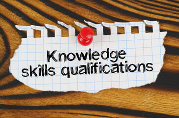 Wall Mural - Attached to the board is an announcement with the inscription - Knowledge skills qualifications