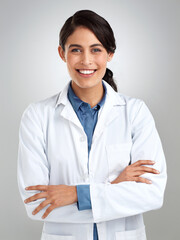 Sticker - Keeping you well is what I do best. Studio portrait of a confident young doctor posing against a grey background.