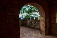 Corridor With Arched Entrance To The Medieval-style Balcony Overlooking The Garden.