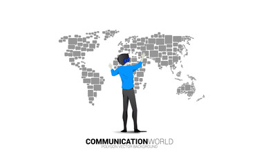 Poster - Silhouette businessman wear VR glasses with group of speech bubble icon shape to world map . concept of communication network in metaverse.