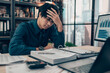 © Charnchai saeheng - Serious Investors have a headache while working  on the desk.  Accounting and  Financial concept.