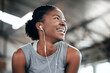 © Beaunitta V W/peopleimages.com - They fell for her madness. Shot of a happy woman using earphones at the gym.