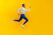 © deagreez - Full length profile portrait of excited active person hurry rush fast empty space isolated on yellow color background
