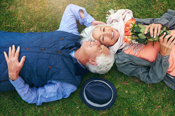 Sticker - He still buys me roses. Portrait of a senior couple enjoying the day together in a park.