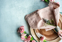 Overhead View Of A Pink Place Setting With Carnations And Gypsophila Stems