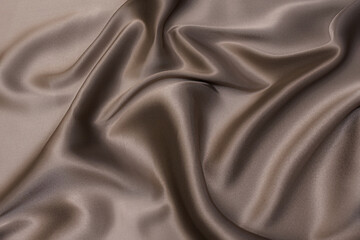 Wall Mural - Close-up texture of natural beige fabric or cloth in brown color. Fabric texture of natural cotton or linen textile material. Beige canvas background.