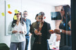 Leinwandbild Motiv Group of businesspeople sharing their ideas in an office