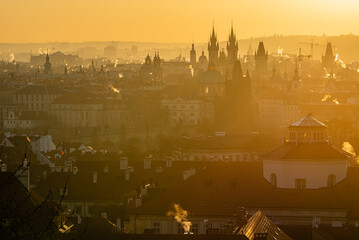 Wall Mural - A Prague cityscape in the strong sunrise light.