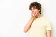 © Asier - Young caucasian man isolated on white background thoughtful looking to a copy space covering mouth with hand.