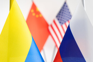 Wall Mural - State flag of Russia and Ukraine. China USA flags on background. Russian Ukrainian war conflict