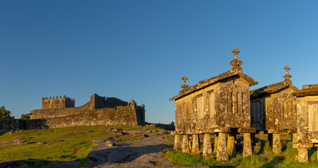 Sticker - Lindoso Castle and historic stone granaries in the village of Lindoso in Portugal in warm evening light