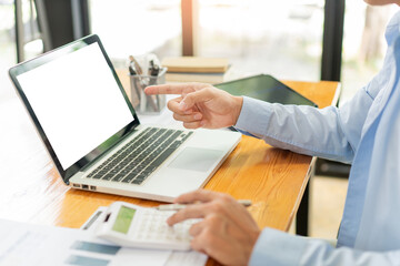 Wall Mural - Business analyst concept the accountant using a calculator to estimate the amount of profits