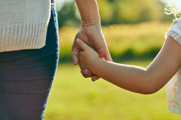 keep them close, keep them safe. cropped shot of a little girl holding an unrecognizable womans hand