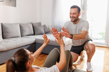 Couple Doing High Five After Home Workout