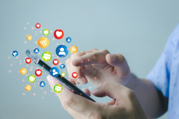 Wall Mural - Social media technology concept, man hand using smartphone Login to the online network Use social media to do business and marketing payment from home through the Internet.