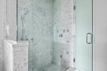 Wall Mural - Modern Glass and Tile Shower. White and gray marble tile shower with glass doors and stainless steel fixtures.