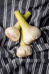 Sticker - Whole garlic bulb. Fresh white garlic on kitchen napkin.