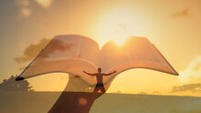 Man Worshiping Go With Arms Outstretched Up To The Sunrise. Hand Holding Bible. Double Exposure 
