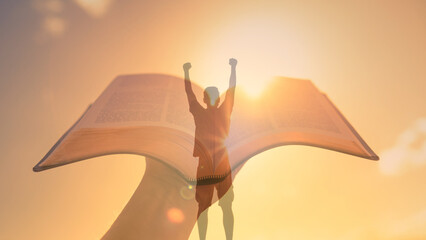 Wall Mural - Bible open to the light. . Man standing strong in belief in god. .