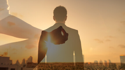 silhouette of a man in the city feeling at peace. Mind body and spirit concept. 